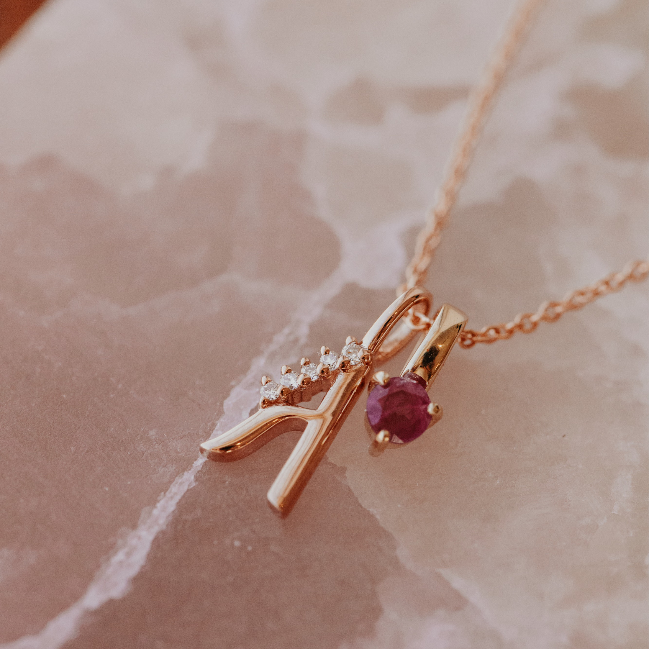 The Initial Pendant paired with The Stackable Gemstone Charm Necklace,