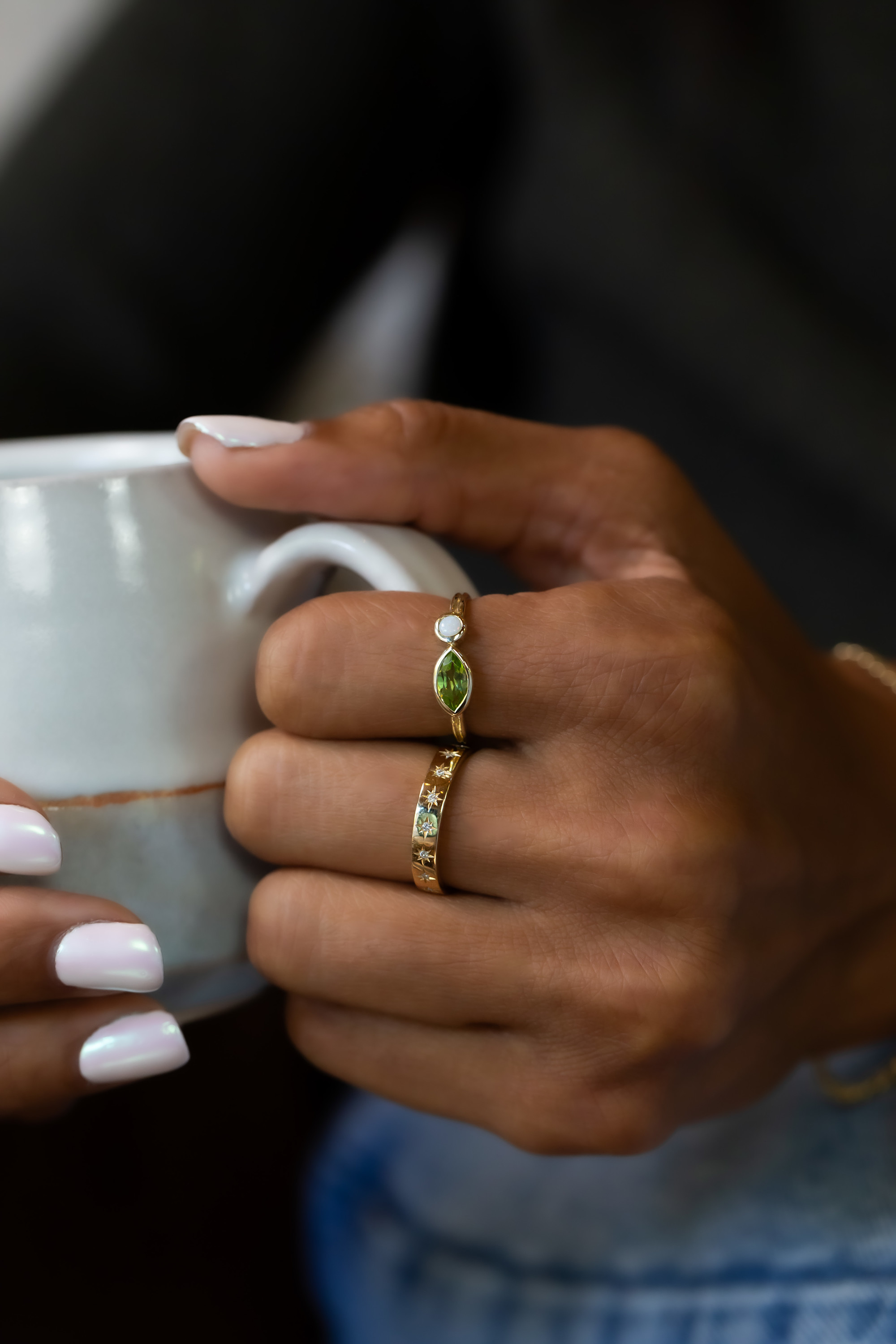 Peridot ring paired with a gold estelle band