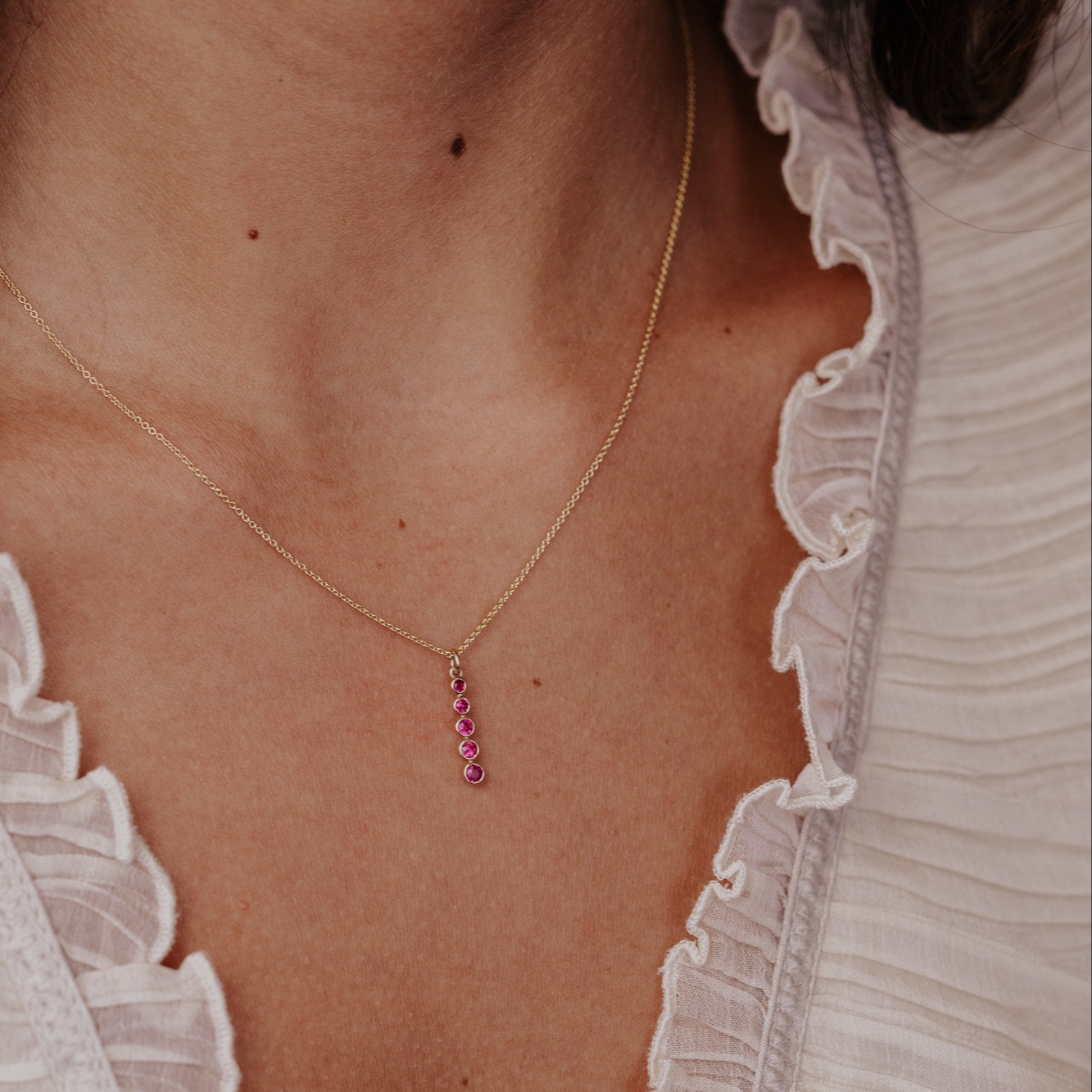 Ruby Necklace on a models neck.