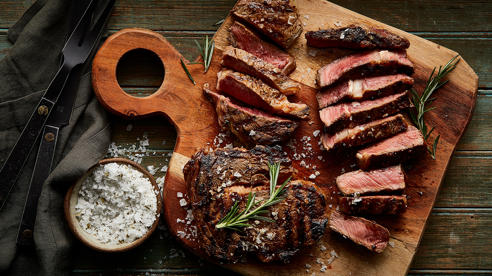 USDA Prime ribeye sliced on a cutting board