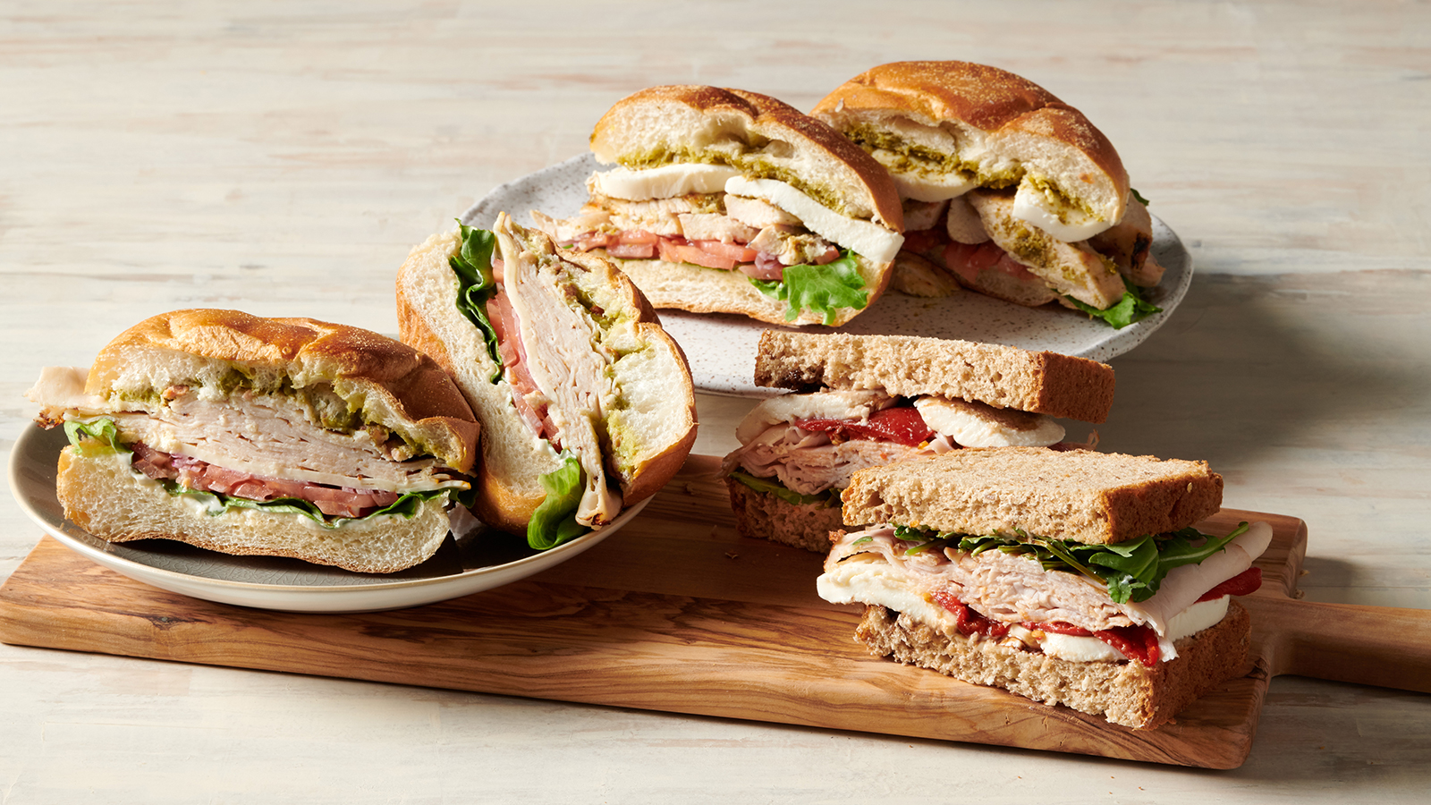 Chicken Bacon Club with Guacamole & Grilled Chicken Caprese Pesto Sandwich