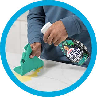 A person cleaning a kitchen countertop with CleanFreak Unstopables