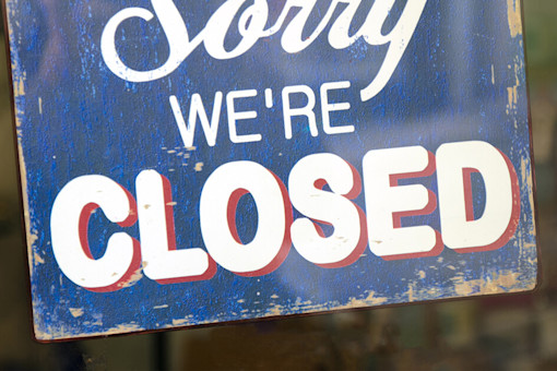 Sorry we're closed sign on shop window