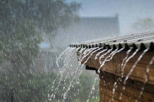 Heavy rain running down a shed room