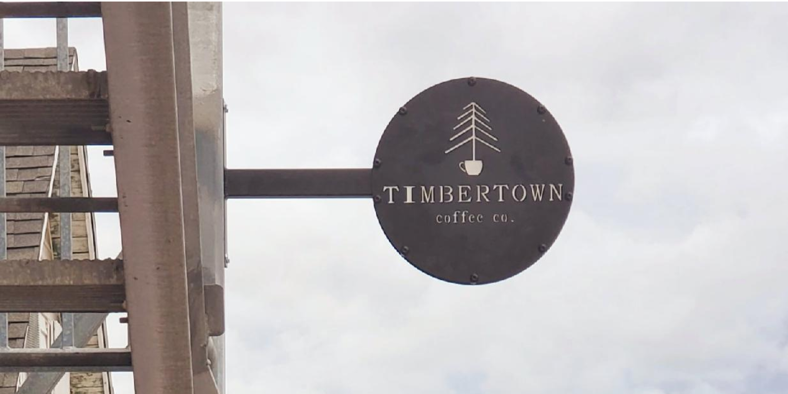 A hero image of the Timbertown Coffee sign