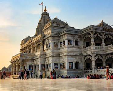 Indulge in Mathura's culinary delights with TravelTaxi - The mouthwatering Pedas and Indian sweets.
