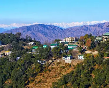 Experience panoramic Himalayan views at Gun Hill with TravelTaxi's ropeway tours in Mussoorie, Uttarakhand.