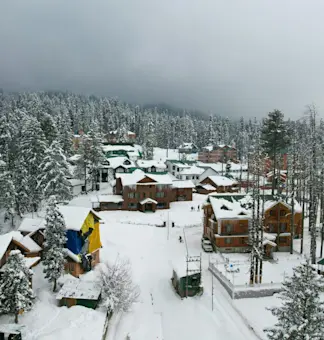 Experience world-class skiing at Gulmarg Ski Resort with TravelTaxi's winter adventure tours in Kashmir.