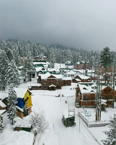 Experience world-class skiing at Gulmarg Ski Resort with TravelTaxi's winter adventure tours in Kashmir.