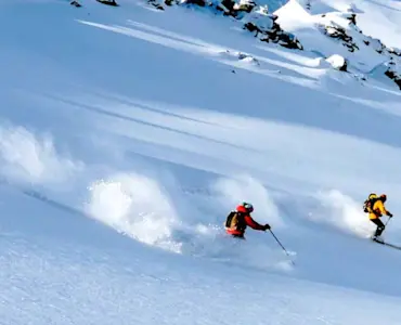 Experience thrilling adventures with TravelTaxi - Skiing in Auli's powdery slopes.