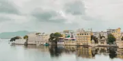 Udaipur's Taj Lake Palace: Luxurious white marble palace seemingly floating on the serene waters of Lake Pichola.