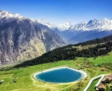Embrace winter wonderland with TravelTaxi - Auli's spectacular snow-capped peaks.