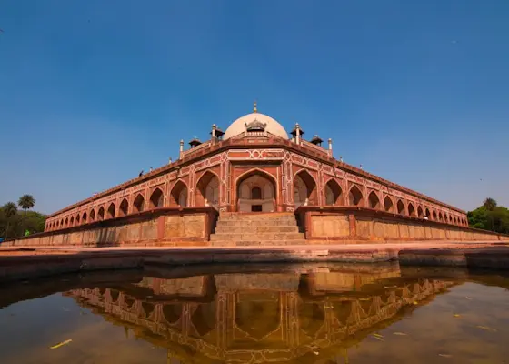 Explore the iconic Red Fort with TravelTaxi for a captivating journey through Delhi's Mughal heritage.