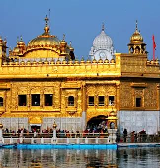 Embrace Amritsar's spiritual essence with TravelTaxi - The serene Sarovar at the Golden Temple.