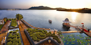 Discover Udaipur's iconic splendor with TravelTaxi - The majestic City Palace.
