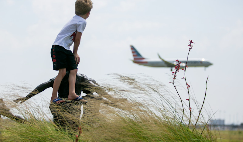 Kids watching plane