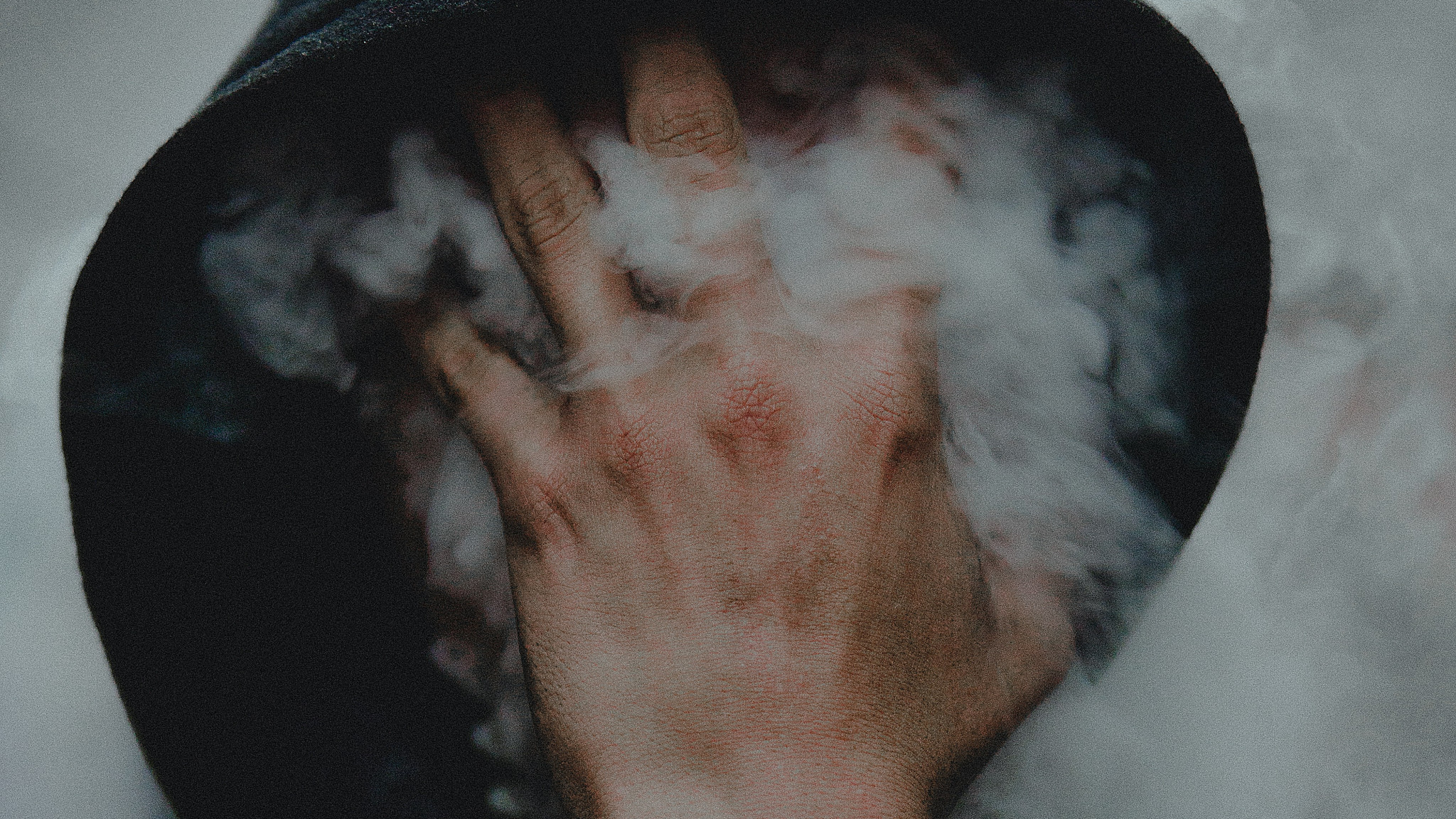 man engulfed in smoke