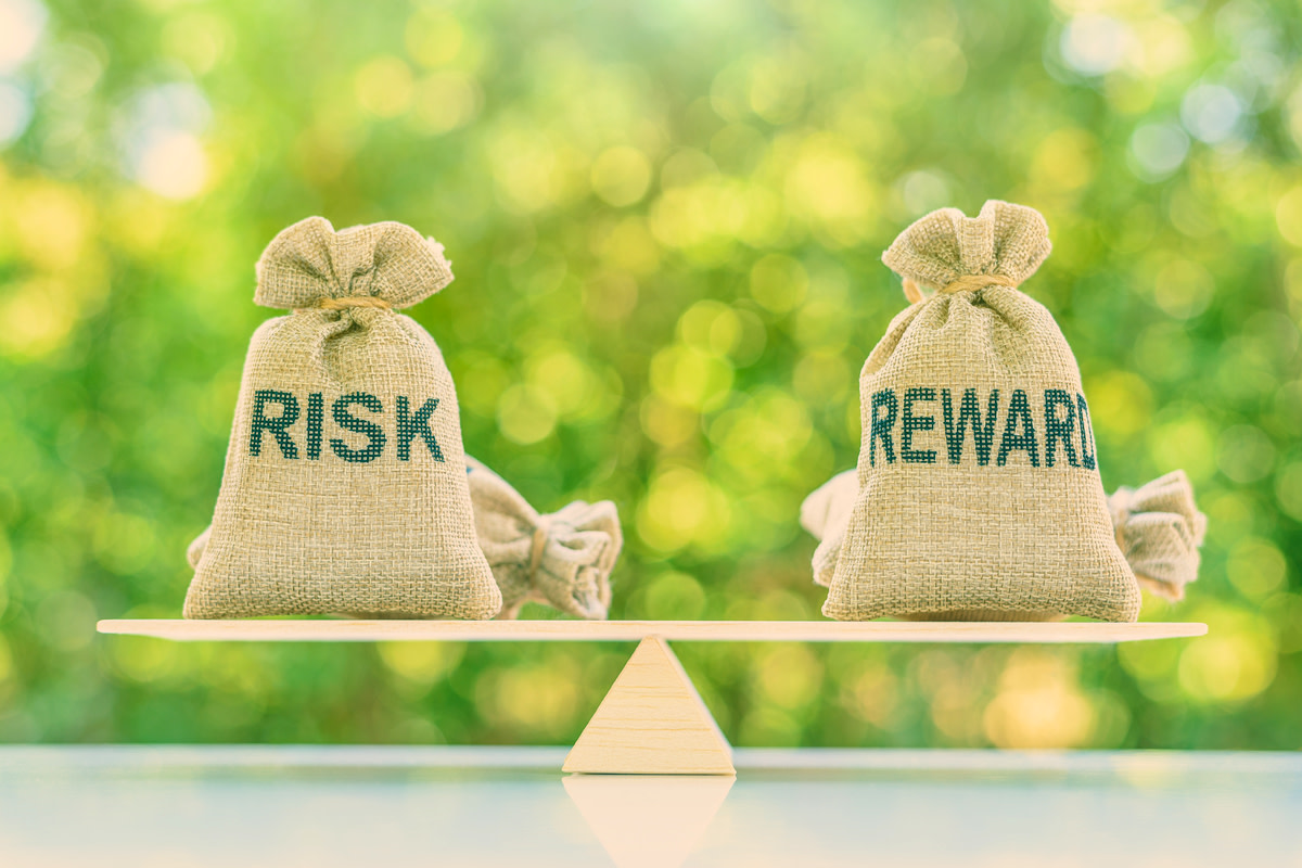 Risk and reward bags on a basic balance scale