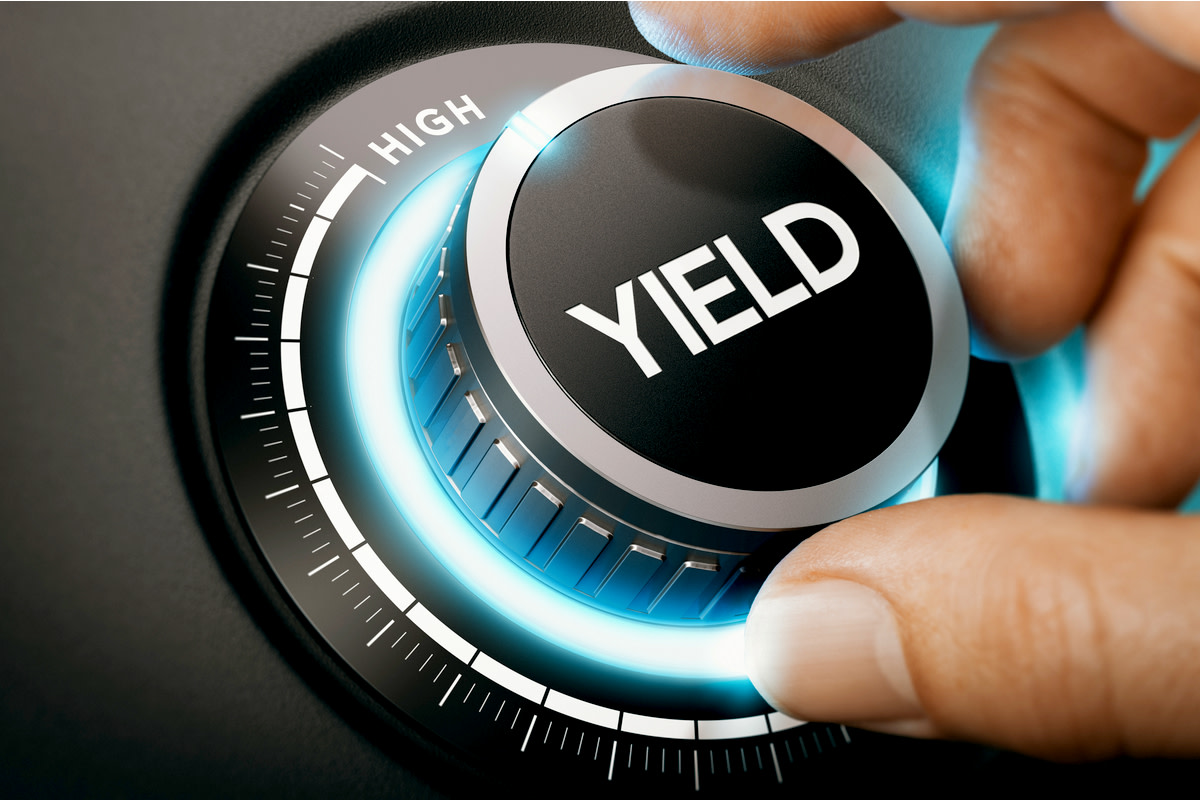 Man turning a knob to select high yield investment.