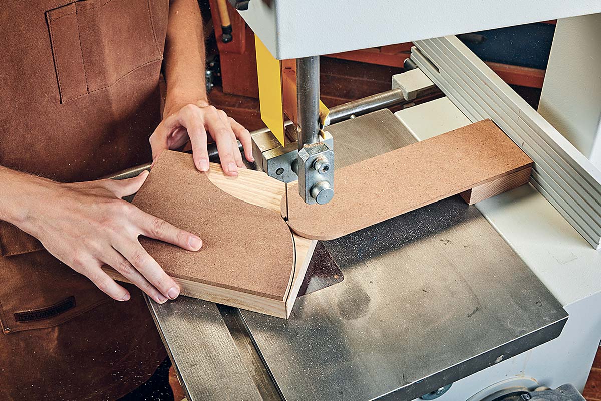 cutting template at the band saw with hardwood rub block to assist with the curves
