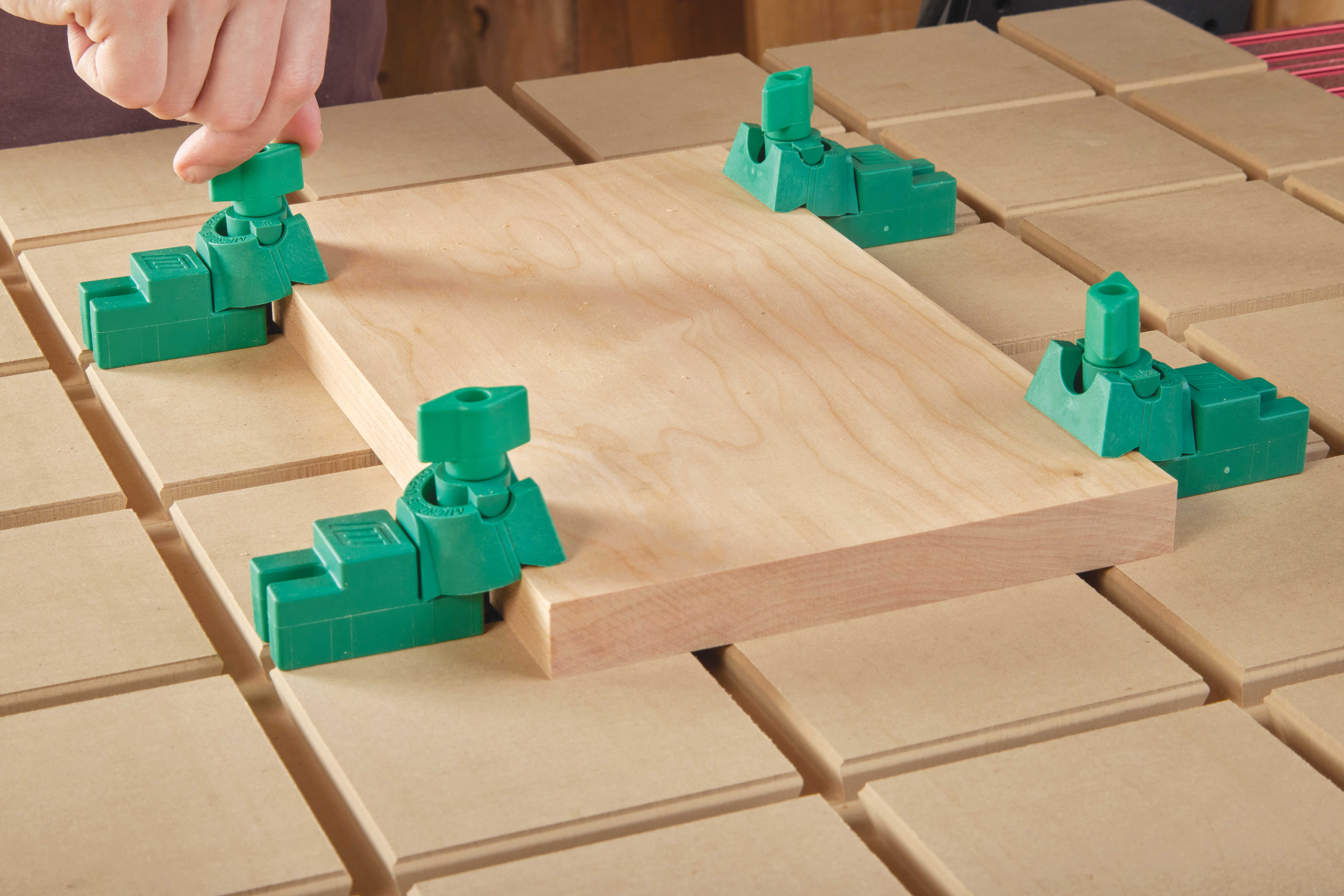 4 u-block clamps locking in the corners of the workpiece