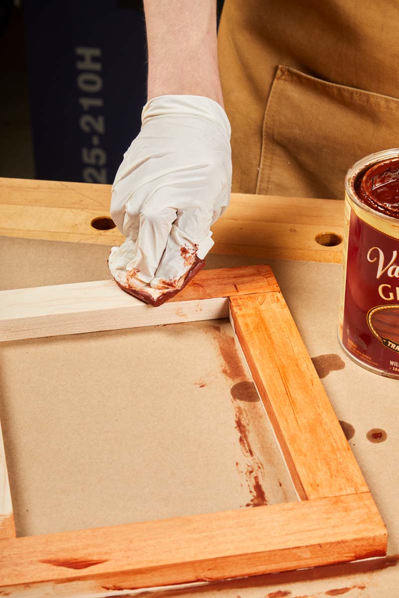 using kraft paper to protect workbench while applying finish on wood frame