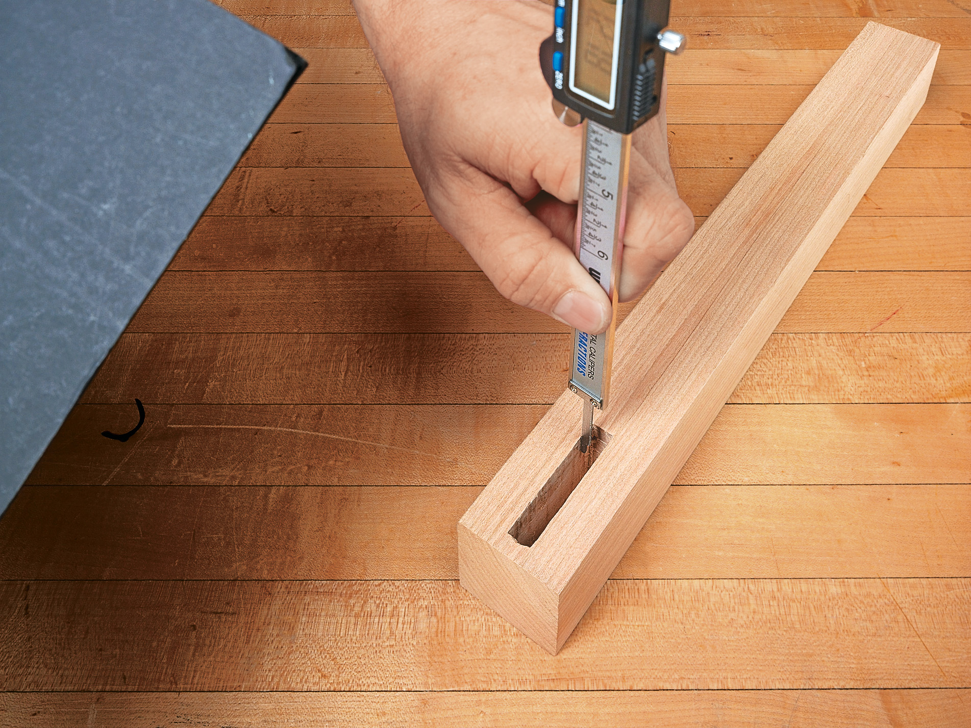 caliper being used for depth measuring