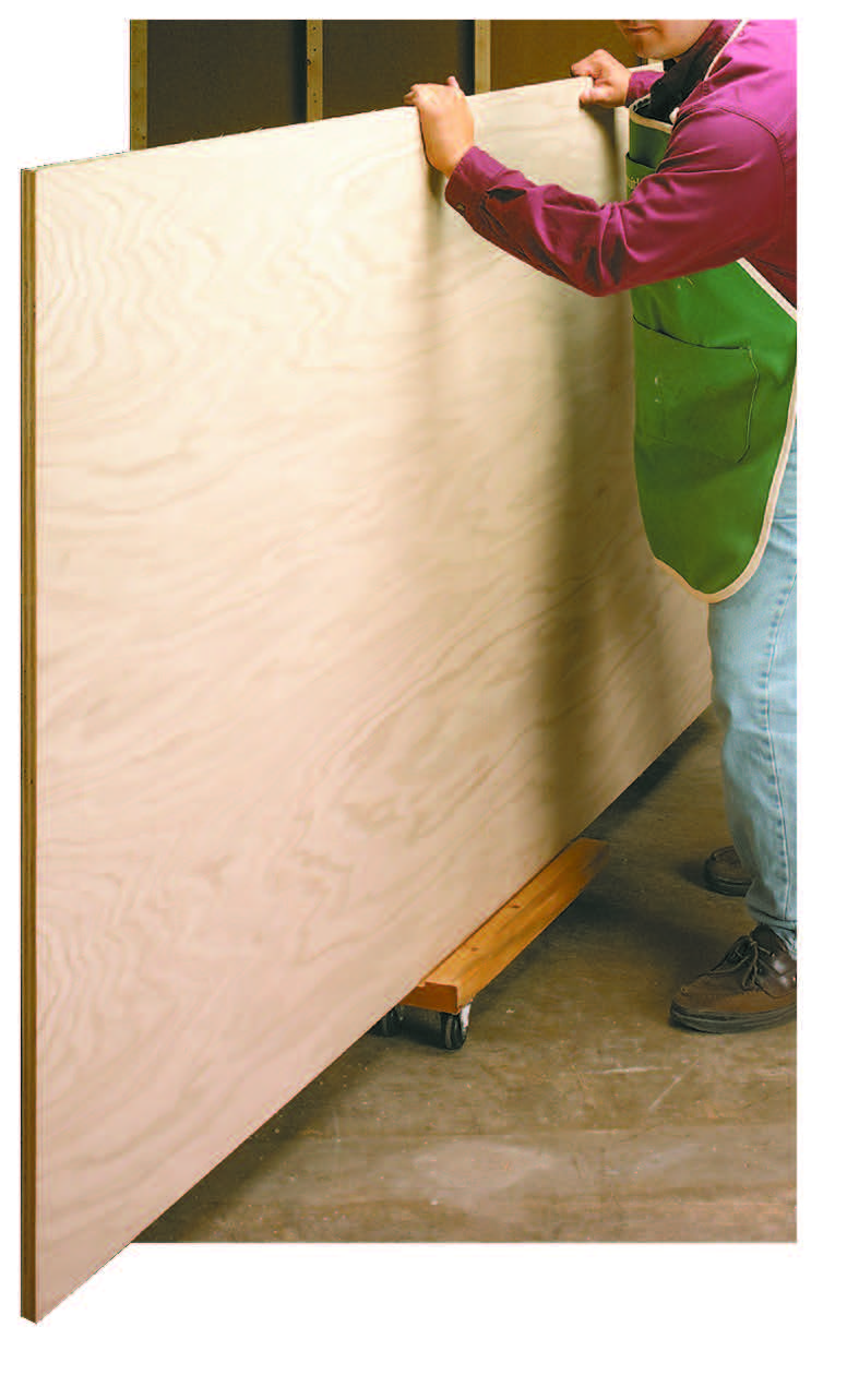 wood dolly being used to move large plywood around a workshop