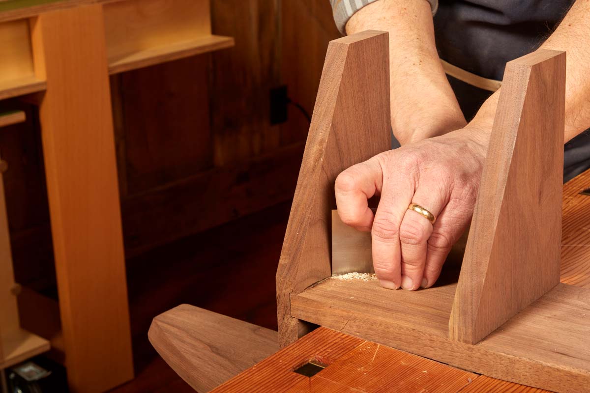 flexibile steel blade card scraper being used on workpiece
