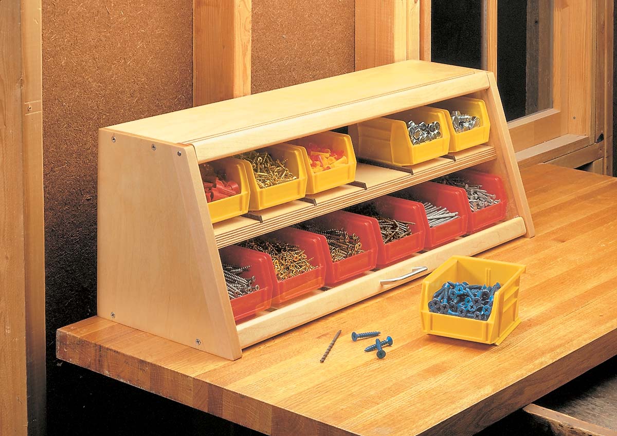 wood table top shelf with plastic yellow and red lidded organizer bins
