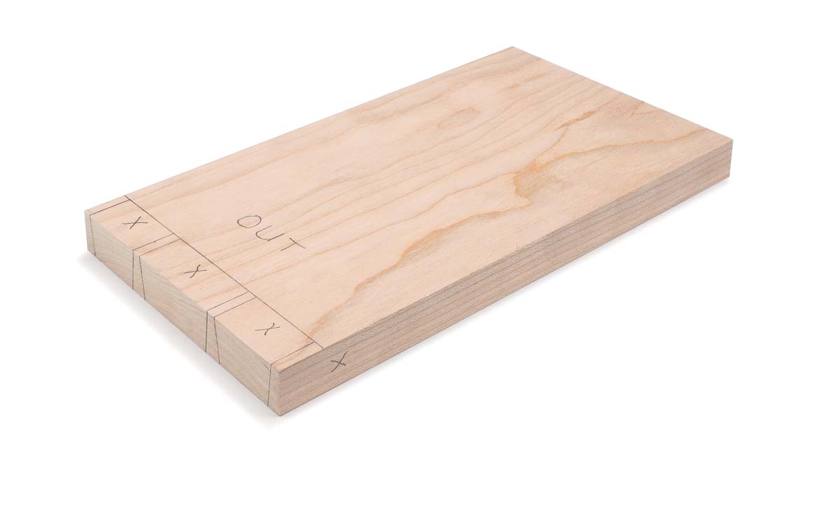 wood piece with pencil marks showing where to cut