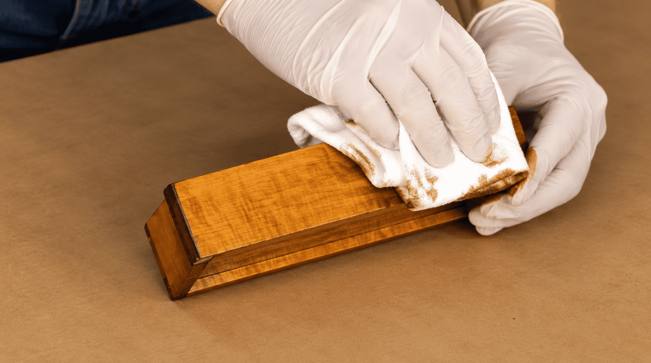 Gloved Hands Finishing Figured Wood Box