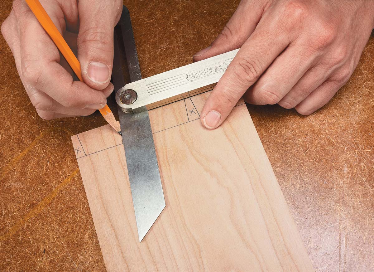 making pencil lines with scribe on wood piece