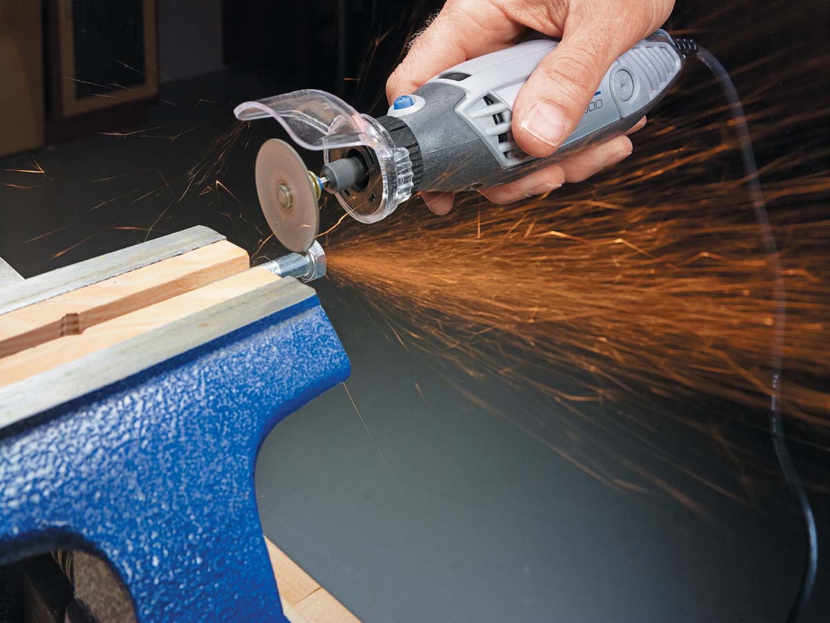 sparks flying while using dremel to cut metal