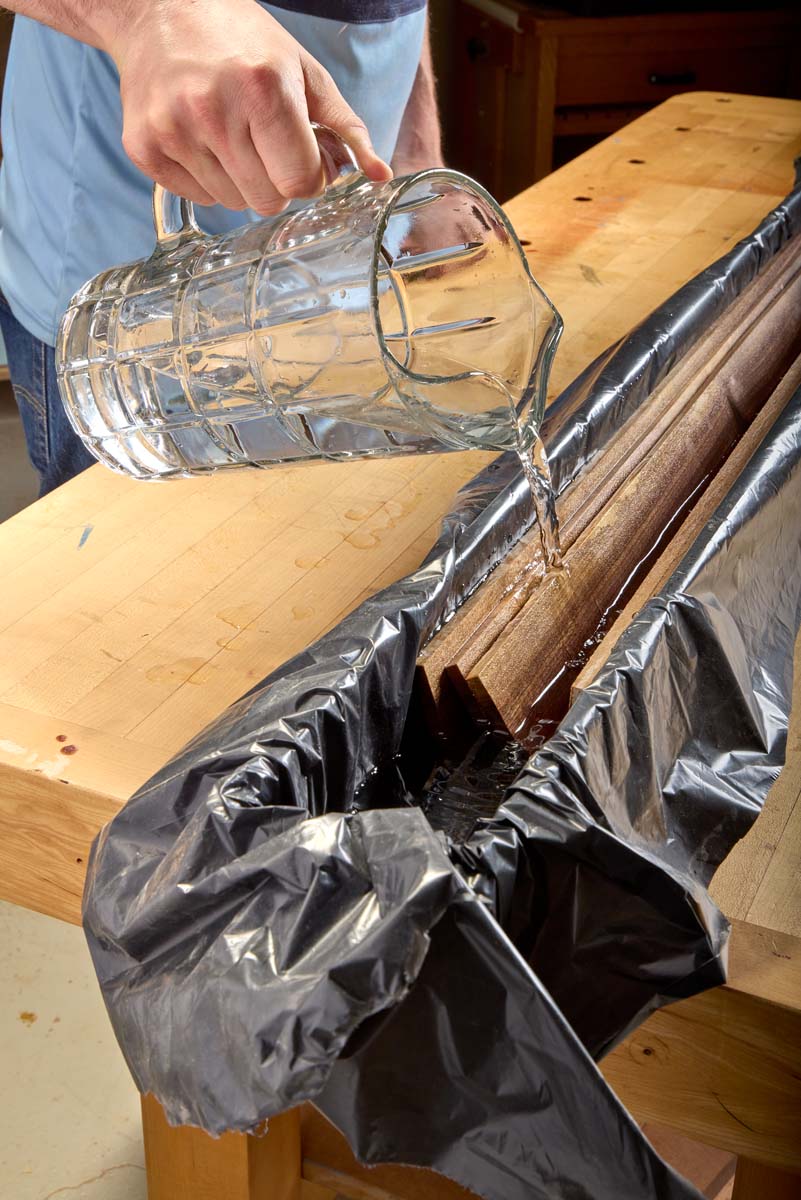 adding water to soak laminated boards