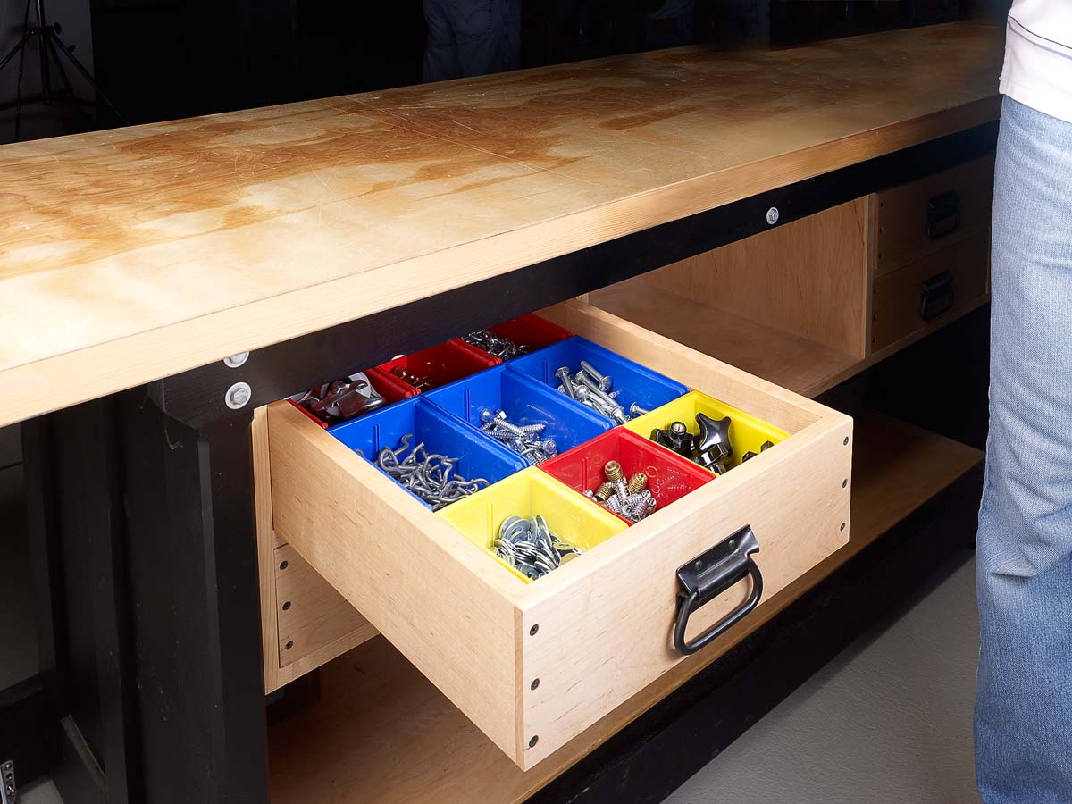 red, yellow, blue plastic bins fit snuggly into wood cabinet drawer