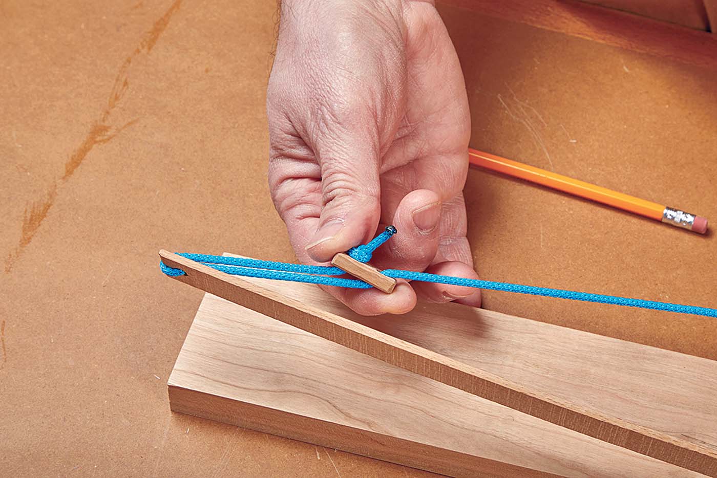 Toggling cord for adjusting the arc of the handmade wood bow with blue string