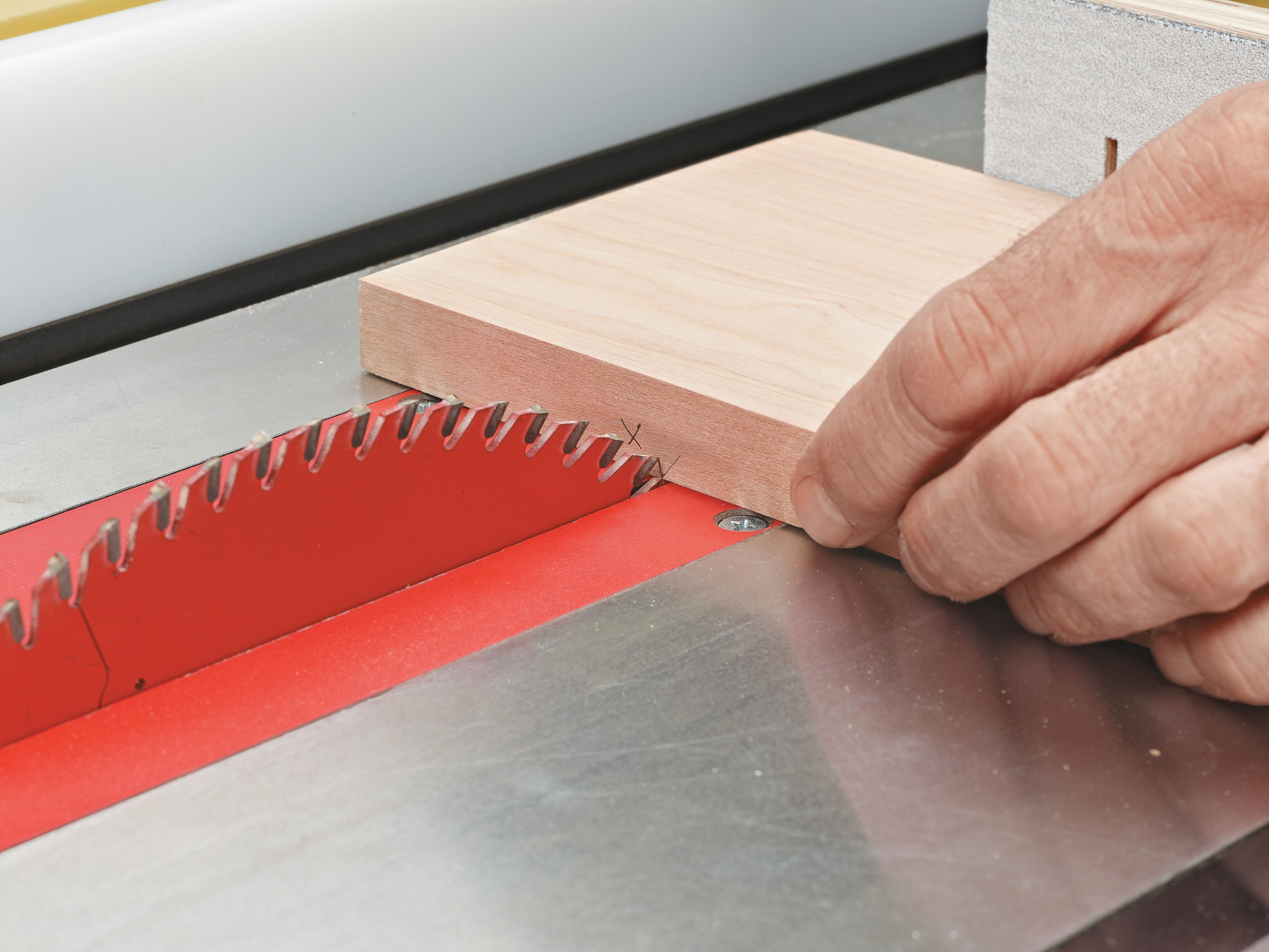 cutting wood with pencil marks using tablesaw