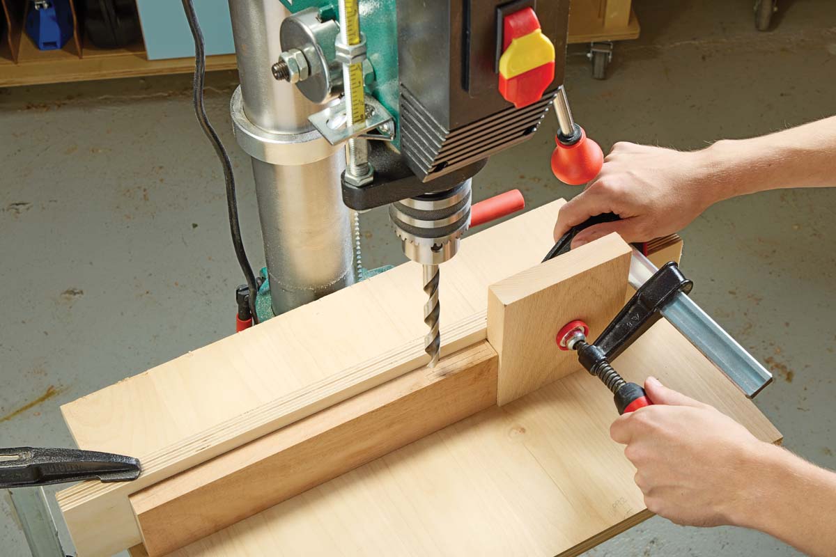 drill setup with stop block and clamp in place