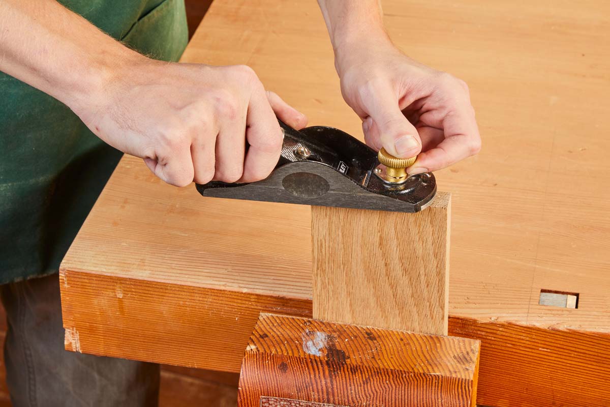 Block Plane being used on edge of clamped wood piece