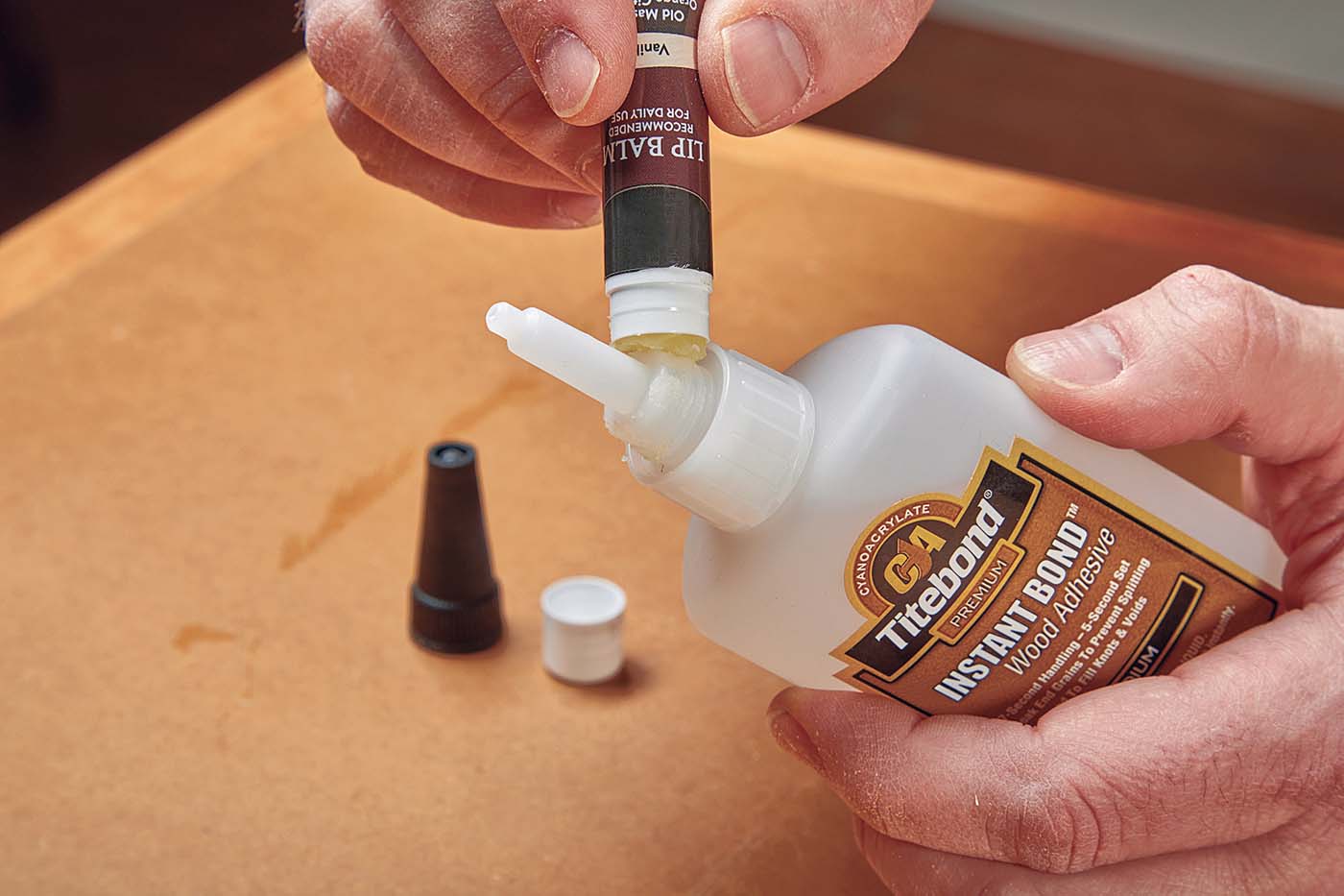 Applying chap stick to sides of wood glue nozzle