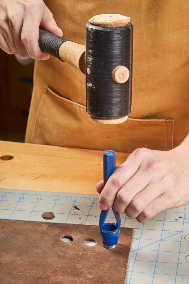 using mallet to help stamp circles on a cutting mat