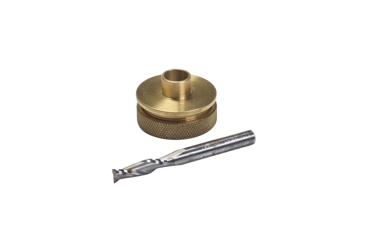 a brass colored guide brushing and a spiral upcut bit