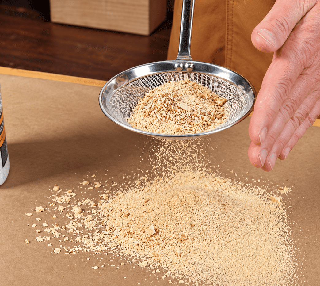 Sifting Sawdust in a Woodworking Workshop