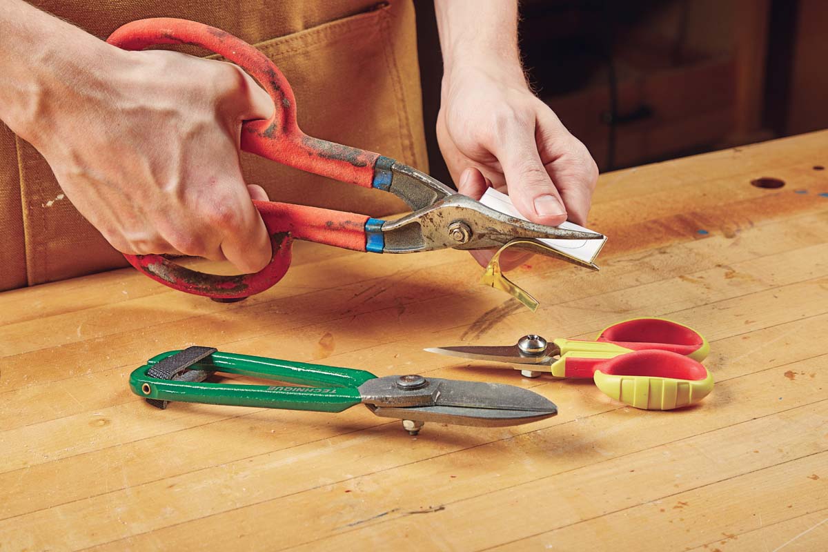 using tinner snips to cut sheet metal