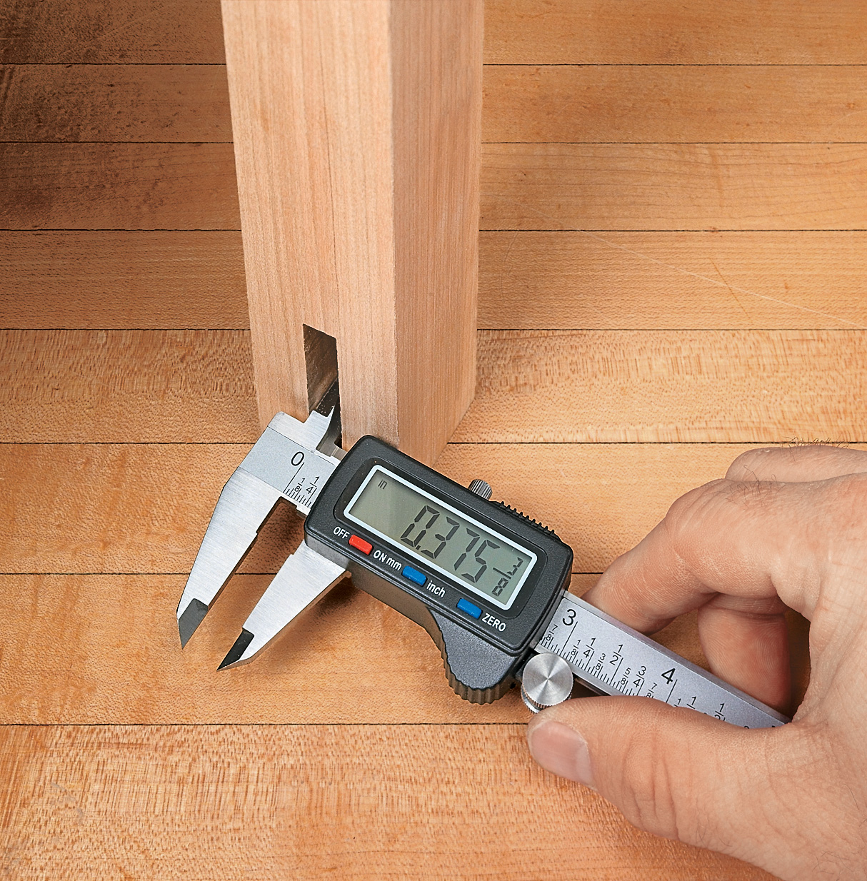 caliper measuring width of this mortise hole