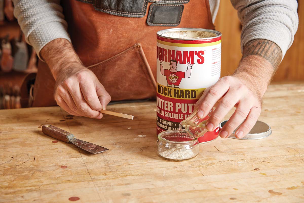 mixing durhams water-based filler in plastic cup
