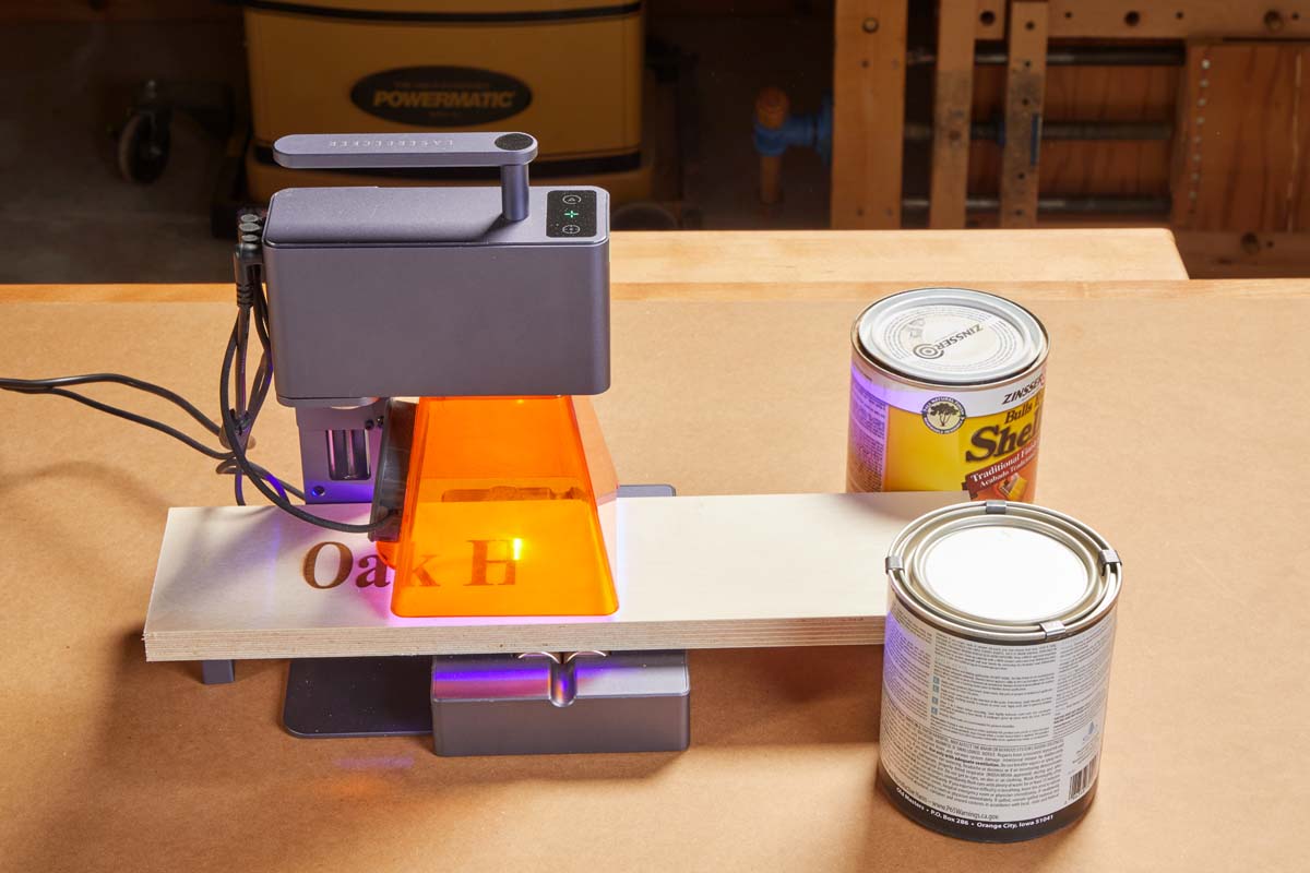 image showing how to use roller to extend image by moving the piece, while use paint cans on either side to balance the piece