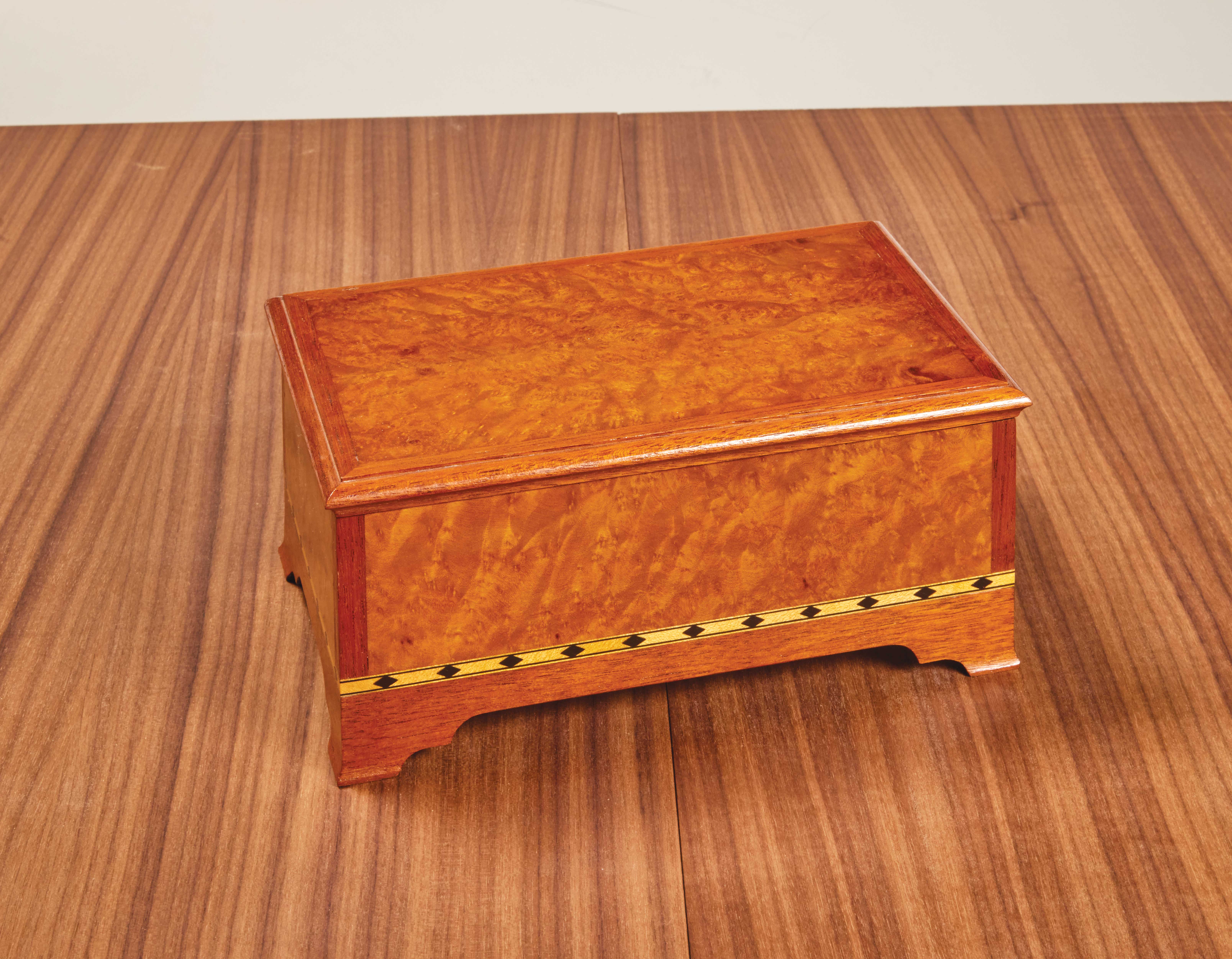 wooden jewelry box with bold burl veneer
