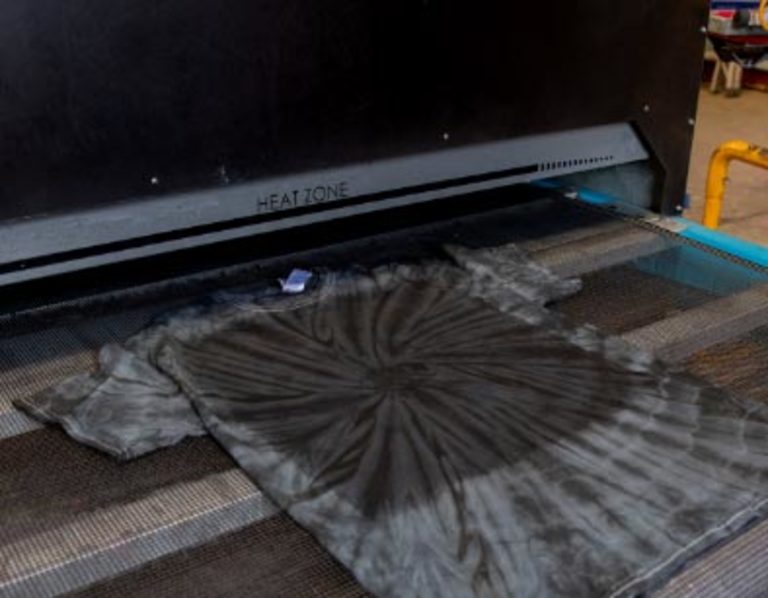 Pre-treatment on a shirt being dried in a convection dryer